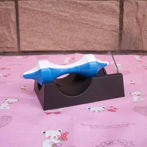 Detailed view of the blue and white magnetic levitation gyroscope toy on a black stand.