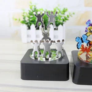 Magnetic metal human figure balancing desktop ornament with square base, interesting creative decor gift.