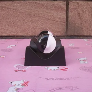 Magnetic levitation gyroscope toy, creative black and white spinning top with base.