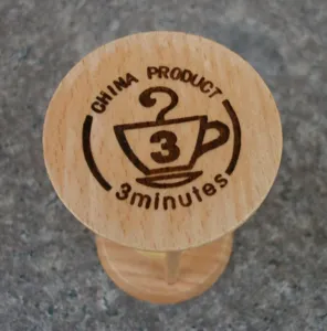 Wooden round 3-minute hourglass timer detail view, perfect for desk decor and daily use.