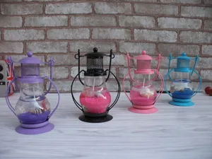 Creative decorative jelly candle lantern with colorful sand and seashells, ideal gift.