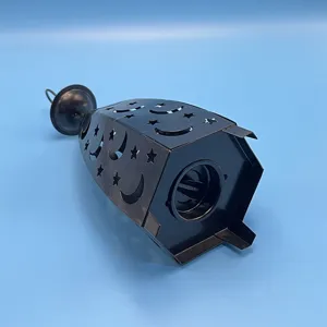 Black iron hollow star and moon candle holder wind lamp for home decor detail view.