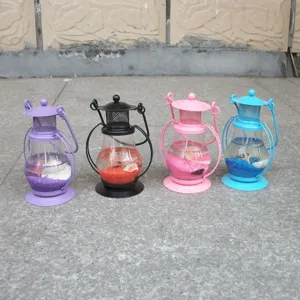 Vintage mini metal glass gel candle lantern with colorful sand and shell filling for home decor.