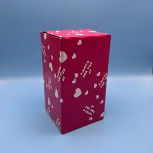 Pink rectangular gift box with white hearts pattern and English text design for packaging.