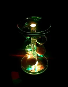 Detailed view of the 8cm crystal luminous base with rotating LED lights for glowing displays.