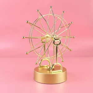 Gold metal perpetual motion desk toy, kinetic art sculpture for home office desk decor