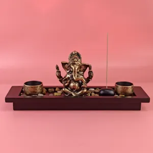 Ganesha incense burner detail showing the intricate resin elephant god statue and wooden tray.