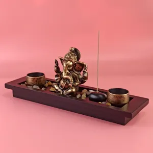 Southeast Asian style Ganesha incense burner set with wooden tray for home decoration.