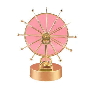 Gold metal frame ferris wheel perpetual motion desk toy, creative home & office decor ornament.