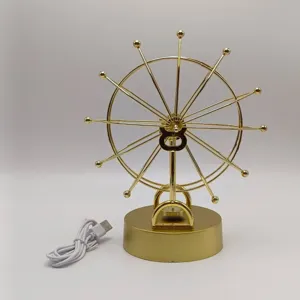 Gold metal perpetual motion machine Ferris wheel desktop decor ornament with USB power cable.
