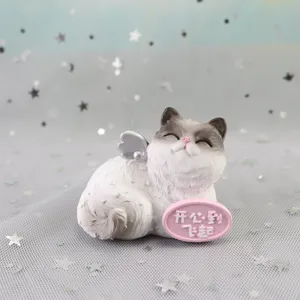 Cute cat resin figurine detail, perfect for car decoration, cake topper or home decor ornament.