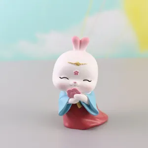 Resin Hanfu rabbit figurine detail, ancient court style ornament for car or cake decoration.