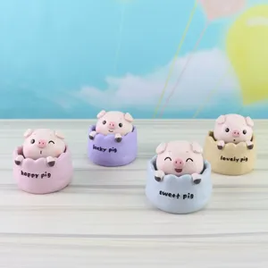 Cute resin pig bobblehead ornament detail view, lovely animal desktop decoration figurine.