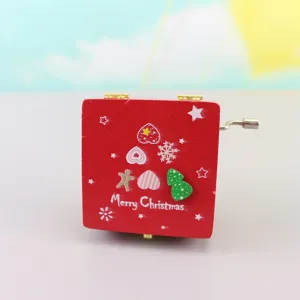Wooden hand-crank music box with Christmas theme design, perfect holiday gift for kids and friends.