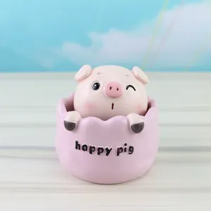 Cute pink pig resin ornament detail view, lovely cartoon animal figurine with happy pig text.