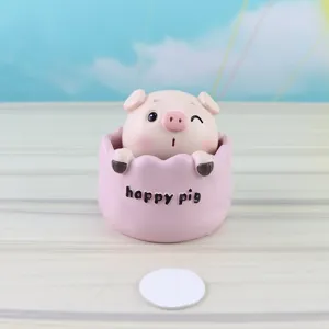 Cute nodding pig resin ornament detail view, perfect for car decor or birthday cake decoration.