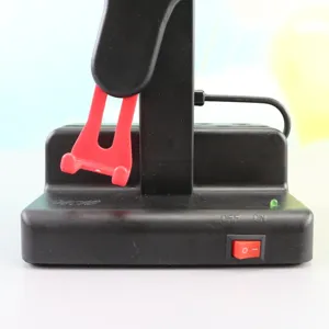 Automatic phone rocker base detail showing power switch and indicator light for step counting.