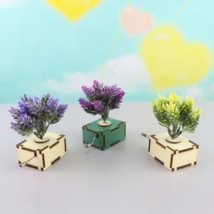 Wooden hand-cranked music box with artificial lavender flowers, creative miniature craft gift.