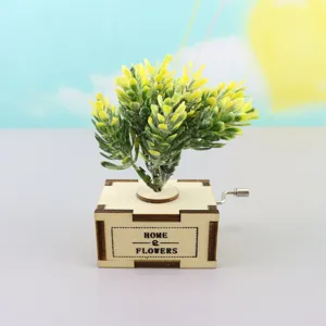 Wooden hand-crank music box with simulated green plant decor, cute desktop ornament gift.