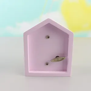 Wooden house wind-up music box detail shot, pink aesthetic music box gift for kids and home decor.