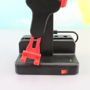 Automatic phone shaker step counter for walking apps, black and red plastic device with switch.