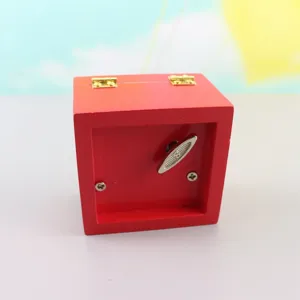 Red wooden hand crank music box detail view with mechanical movement gift item!