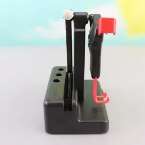 Automatic phone rocker pedometer for step counting, black plastic swing device with red holder.