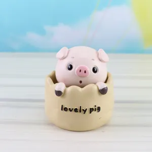 Cute shaking pig resin ornament detail shot, perfect for car decor or birthday cake decoration.