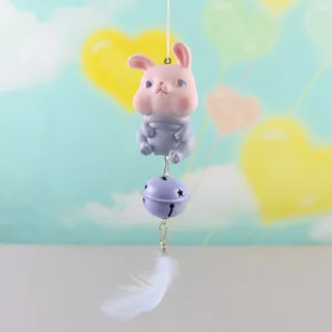 Cute cartoon animal hanging ornament with purple bell and white feather, creative decor.