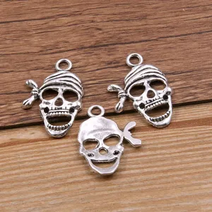 Silver metal skull charms for DIY jewelry making, spooky Halloween pendant accessories.