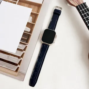 Detailed view of dark blue crocodile texture watch strap with pin buckle for smartwatch.