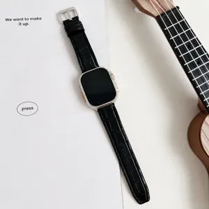 Black silicone leather watch strap with bamboo pattern and silver pin buckle detail.