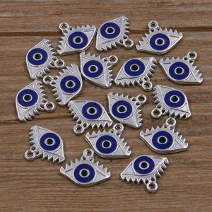 Close-up details of silver tone enamel evil eye alloy charms pendants for DIY jewelry making.