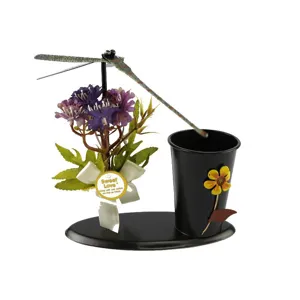 Creative rotating dragonfly iron pen holder with artificial flowers and desktop ornament.