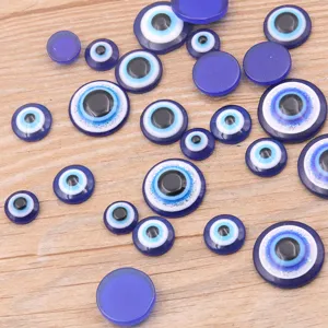 Blue evil eye resin flatback cabochons for DIY jewelry making and phone case decoration.