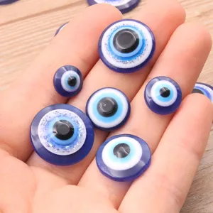 Resin evil eye flatback cabochons in mixed sizes, perfect for DIY phone case decor and crafts.