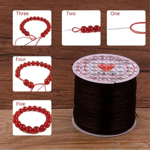 cordon elastico de cristal negro para abalorios y pulseras DIY con guia de tutorial paso a paso.