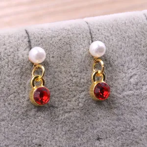 Gold alloy diy earrings with white pearl and red crystal charm detailed fashion accessory.