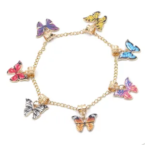 Gold-tone metal chain bracelet featuring colorful enamel butterfly charms for DIY jewelry making.