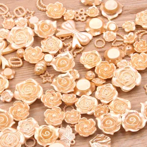 Assorted resin rose flatback cabochons mixed craft accessories for DIY phone cases and jewelry.