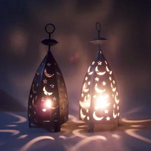 Hollow star and moon iron candle holder detail, retro metal wind lantern for home decor.