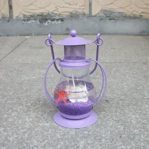 Purple jelly candle lantern with seashell and starfish detail, creative craft ornament decor.