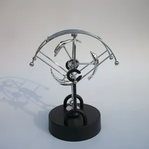 Metal kinetic art perpetual motion desk toy with jumping dolphins for home office decor