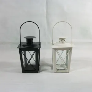 Metal Moroccan style candle lantern detail shot, black and white iron candlestick decor.