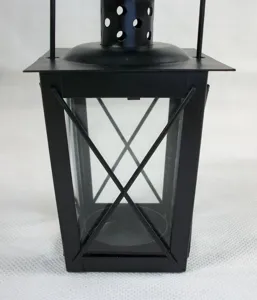 Detailed close-up of the black iron glass candle lantern highlighting the exquisite frame design.