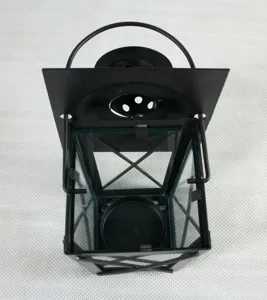 Black metal candle lantern detail view, Moroccan style decorative iron wind lamp for home.