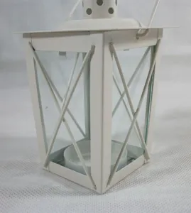 White iron and glass candle lantern for home decoration and romantic wedding ornaments.