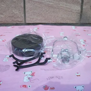 Detail view of perpetual motion toy parts, including base and metal swing frame components.