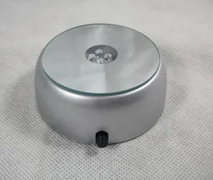 Detail of silver 7cm round LED lighted display base with mirror top and switch for crystal crafts.