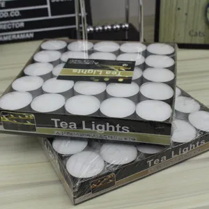 Smokeless scented tea light candles detail view in aluminum cups, bulk pack of white wax.